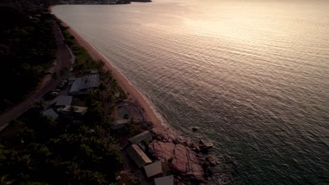 revealing-drone-shot-of-nomads-bacpacker-hostel-and-Nelly-Bay-in-Magnetic-Island-at-sunrise
