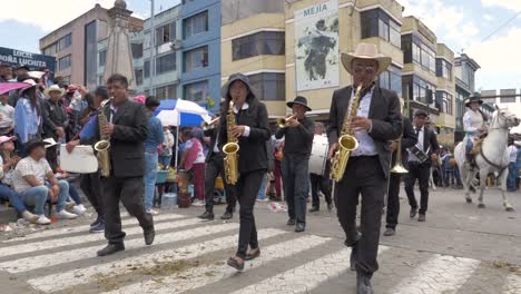 Experience-the-charm-of-a-quaint-town-band-as-three-saxophonists-march-in-sync,-playing-melodious-tunes-during-the-delightful-Chagra-Processional-Parade