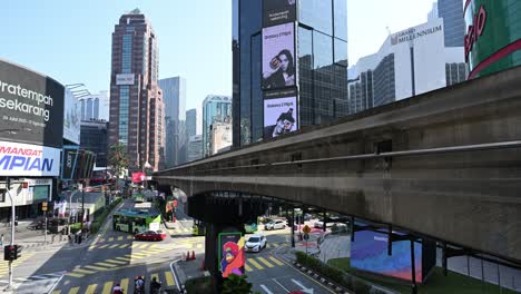 Iconic-and-busy-Bukit-Bintang-district-of-Kuala-Lumpur-with-its-monorail-train-station,-Malaysia