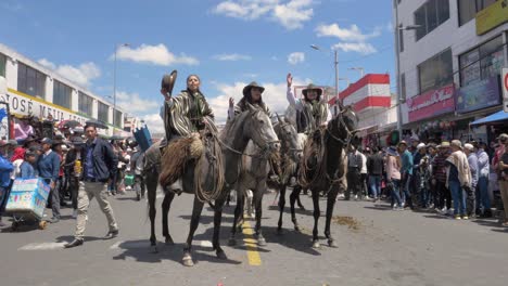 Capture-the-elegance-and-spirit-of-female-riders-as-they-gracefully-greet-the-crowd-and-cheer-'Viva-Machachi'-while-mounted-on-their-horses