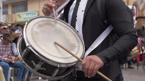 Experience-the-lively-atmosphere-as-a-member-of-an-Ecuadorean-popular-music-band-performs-with-full-enthusiasm-during-the-dynamic-Chagra-Processional-Parade