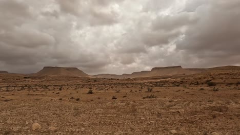 Rainy-weather-over-Tunisia-desert-road,-car-driver-POV