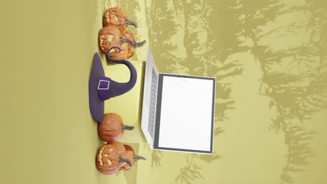 Campaña-Publicitaria-De-Halloween-Con-Laptop-De-Pantalla-En-Blanco,-Vertical