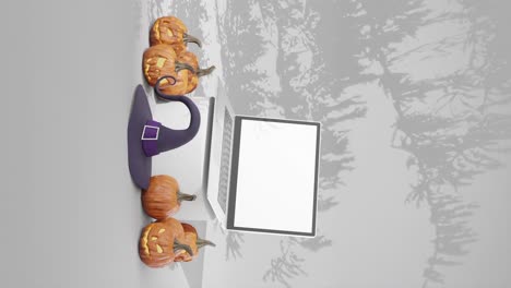Laptop-with-blank-screen-mockup-for-advertisement,-halloween-theme,-vertical