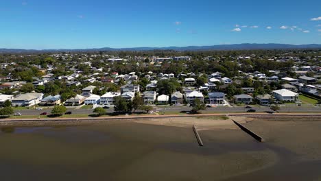 Aerial-view,-left-to-right,-of-Sandgate-and-Brighton-waterfront-on-a-sunny-day,-Brisbane,-Queensland,-Australia