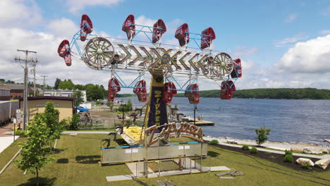 Static-aerial-footage-of-s-Carnival-Fairground-ride-called-Zipper,-city-of-Bath,-Maine