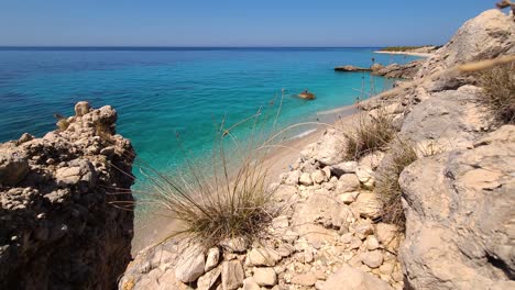 Untouched-coastline-with-paradise-beaches-sheltered-by-cliffs-in-Mediterranean,-perfect-sea-scape-for-summer-vacation