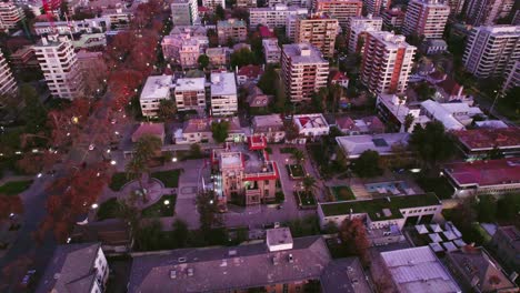 Aerial-view-establishing-in-the-heart-of-Providencia-with-the-Falabella-Palace-and-residential-buildings-in-Santiago,-Chile
