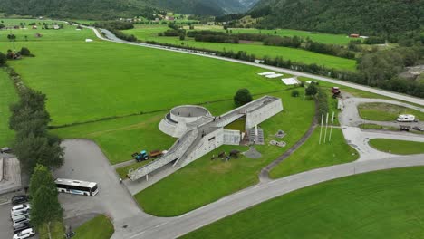 Fjaerland-Glacier-bremuseum-high-angle-aerial---Presenting-front-of-award-winning-building-and-Boyadalen-valley-in-background---60-fps-Norway
