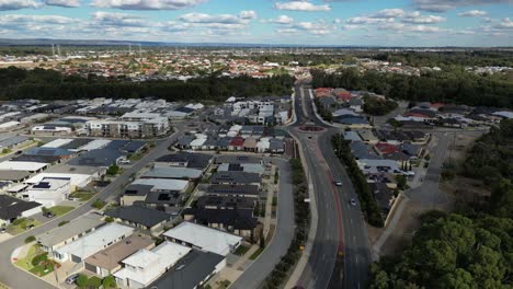 Aerial-flyover-traffic-on-road-in-Australian-suburb-area-of-Perth-City-with-luxury-houses