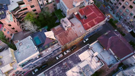 Dolly-in-establishing-aerial-view-of-residential-buildings-in-the-early-morning-hours-lonely-streets-of-the-bohemian-neighborhood-of-Lastarria