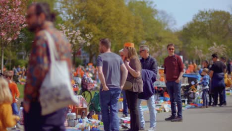 People-watching-at-stalls-at-a-children's-flea-market-on-King's-Day-in-the-Netherlands