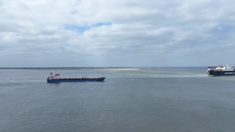 Drone-View:-Cargo-Ships-Navigate-Westeschelde-Waters-in-the-Netherlands