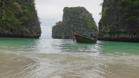 Longtail-Boat-Beached-on-Paradise-Island-Koh-Phi-Phi-Le-in-Thailand-with-Turquoise-Waters