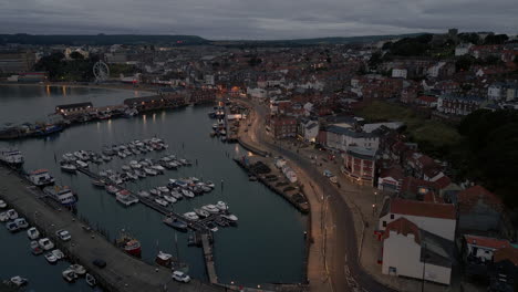 Establishing-Night-Drone-Shot-Over-Scarborough-Harbour-and-Town
