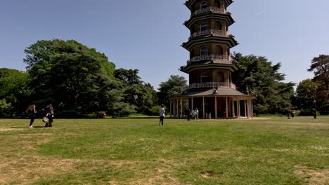 Visitors-Making-Their-Way-To-See-The-Great-Pagoda-At-Kew-Gardens-On-Sunny-Day