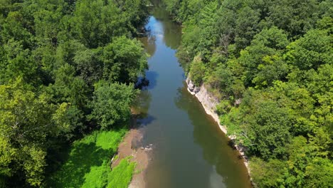 Aerial-drone-view-of-creek-during-sunny-day
