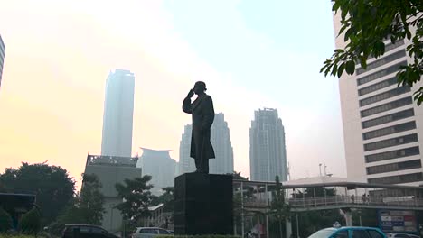 General-Sudirman-Statue-on-a-poor-air-quality-day-in-Jakarta,-Indonesia-wide-angle-shot