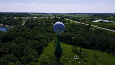 LONG-VIDEO-Drone-Full-360-Degree-Hyper-Time-Lapse-of-the-Historic-Killarney-Lake-Manitoba-Canada-Landscape-Lakeside-Green-Ireland-Iconic-Historic-Architecture-Shamrock-Water-Tower-in-the-Summer-Time