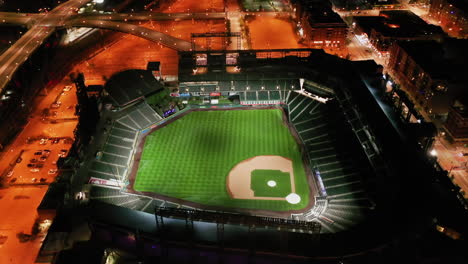 Aerial-view-around-the-illuminated-Coors-Field-stadium,-night-in-Denver,-Colorado