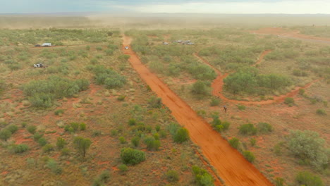 Drone-Flyover-Four-Wheel-Off-Road-Buggy-Racing-Along-Red-Dirt-Desert-Track-In-Australia,-4K