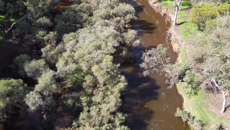 Aerial-Tilt-Down-View-Following-Yellow-Kayak-Competitor-Avon-Descent-Boat-Race-2023,-Perth