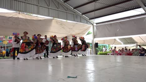 Slow-motion-shot-of-women-and-men-dancing-together-at-the-traditional-Guelaguetza