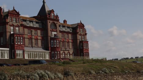 Slow-panning-shot-showing-the-face-of-the-Headlands-Hotel-in-Newquay,-Cornwall