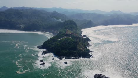 Misty-coastline-of-Indonesia,-aerial-drone-view