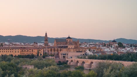 Sunset-close-upview-day-to-night-timelapse-of-Cordoba-Mezquita-Mosque-cathedral-and-roman-bridge-during-summer