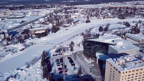 4K-Drone-Video-of-The-William-Ransom-Wood-Centennial-Bridge-over-Frozen-Chena-River-in-Downtown-Fairbanks-Alaska-on-Snowy-Winter-Day