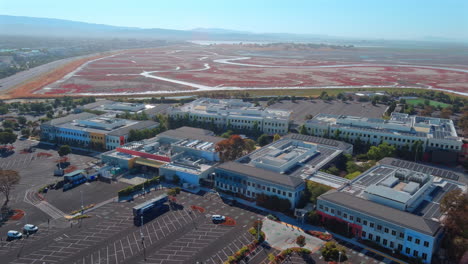 Aerial-view-orbiting-Meta-campus-offices-in-Menlo-park-neighborhood-downtown-headquarters,-California