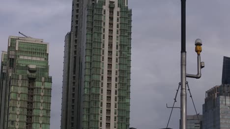 View-of-tall-and-majestic-office-buildings-around-Jalan-Sudirman,-Kuningan,-Jakarta,-Indonesia_pan-shot