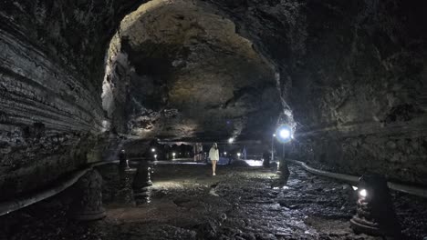 Panning-side-to-side-in-big-open-cave-with-water-dripping