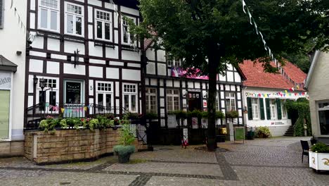 Pov-walk-on-road-of-Tecklenburg-city-with-ancient-medieval-half-timber-houses-and-architecture-of-north-Rhine-Westphalia,-Germany