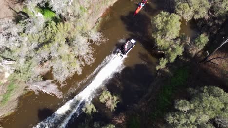 Birds-Eye-View-Over-Speedboat-Racing-Past-Kayak,-Avon-Descent-Perth---Slow-Motion-Clip