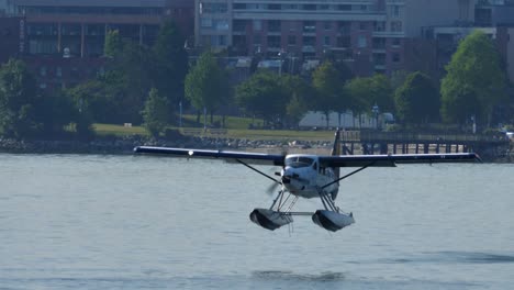 Long-Lens-Tracking-Shot-of-Turboprop-Seaplane-Takeoff-From-the-Water