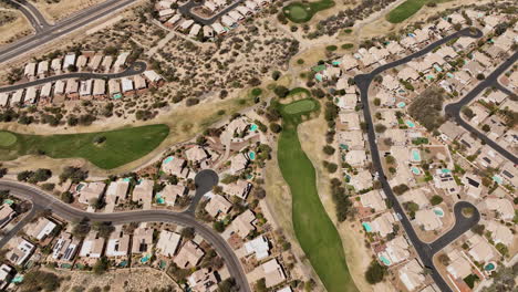 Tucson-Arizona-Aerial-v9-birds-eye-view-drone-lowering-flyover-Canada-Hills-neighborhood-in-Oro-Valley-capturing-residential-homes-and-golf-course-from-above---Shot-with-Mavic-3-Cine---March-2022