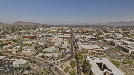 Scottsdale-Arizona-Aerial-v13-cinematic-drone-fly-straight-above-North-Scottsdale-road-capturing-downtown-cityscape-with-low-street-traffics-during-daytime---Shot-with-Mavic-3-Cine---February-2022