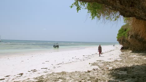 Masai-People-Walking-On-The-White-Sandy-Beach-of-Mombasa-in-Kenya,-Africa