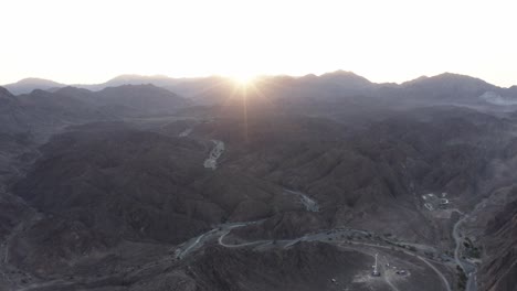 Mystic-morning:-Aerial-view-of-foggy-Wadi-Shawka-trail,-Ras-Al-Khaimah