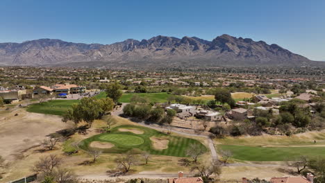 Tucson-Arizona-Aerial-v4-low-flyover-Oro-Valley-Canada-Hills-residential-neighborhoods-capturing-El-Conquistador-golf-course-overlooking-at-desert-mountainscape---Shot-with-Mavic-3-Cine---March-2022