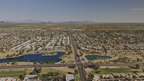 Scottsdale-Arizona-Aerial-v9-drone-flyover-Chaparral-lake-community-park-capturing-residential-neighborhoods,-farmland-and-mountain-desert-landscape-at-daytime---Shot-with-Mavic-3-Cine---February-2022