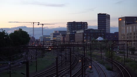 Train-station-and-city-skyline-in-Copenhagen-after-sunset
