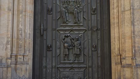 the-majestic-front-door-of-Metropolitan-Cathedral-of-Saints-Vitus,-Wenceslaus-and-Adalbert-a-Roman-Catholic-metropolitan-cathedral-in-Prague,-Czech-Republic