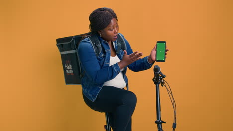Female-Carries-Phone-With-Green-Screen