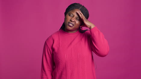 Black-Woman-In-Sweater-Having-Headache