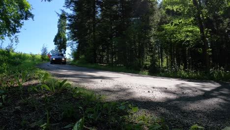Black-Racing-Car-Turning-in-Forest-during-Rally,-4k-Slow-Motion-GoPro-Footage