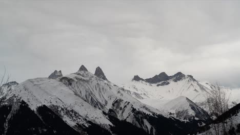 Rocky-mountains-covered-in-snow,-time-lapse-view