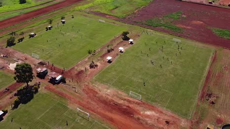 Drone-orbit-around-multiple-football-fields-with-teams-playing-football---Posadas-hipodrome
